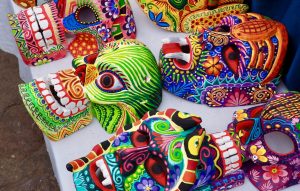 Colorful masks on display at a Chichicastenango market.