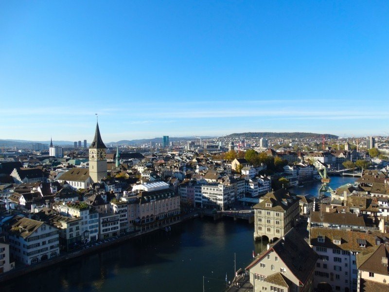 A breathtaking view of the city of Zurich, Switzerland from the top of a hill.