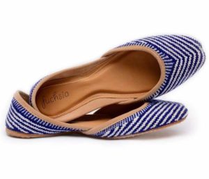 Stylish blue and white striped flats, perfect for globetrotting fashionistas or as a thoughtful present for travelers.