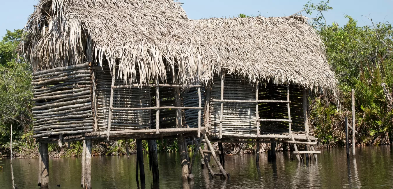 A picturesque hut on stilts in the tranquil waters of Riviera Nayarit, creating a stunning scene for travelers seeking a unique and captivating experience.