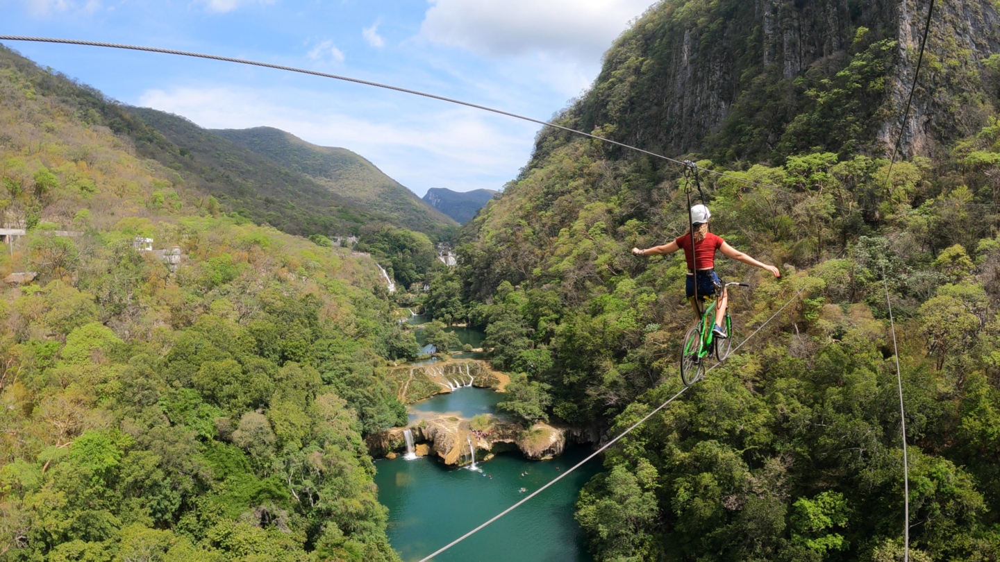 Riding bikes on zip lines over waterfalls in huasteca potosina