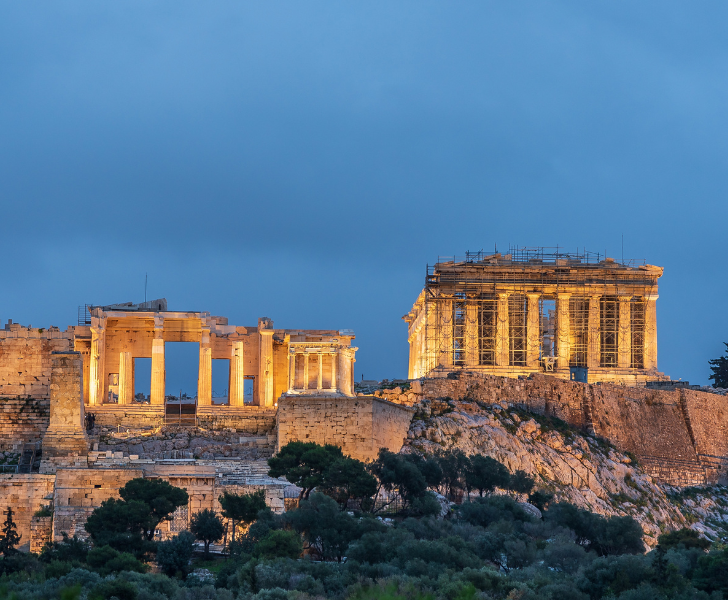 The acropolis in Acropolis, Greece at dusk is a must-see on any Europe itinerary.