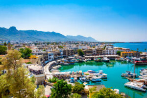 Busy harbor view with boats in scenic coastal town