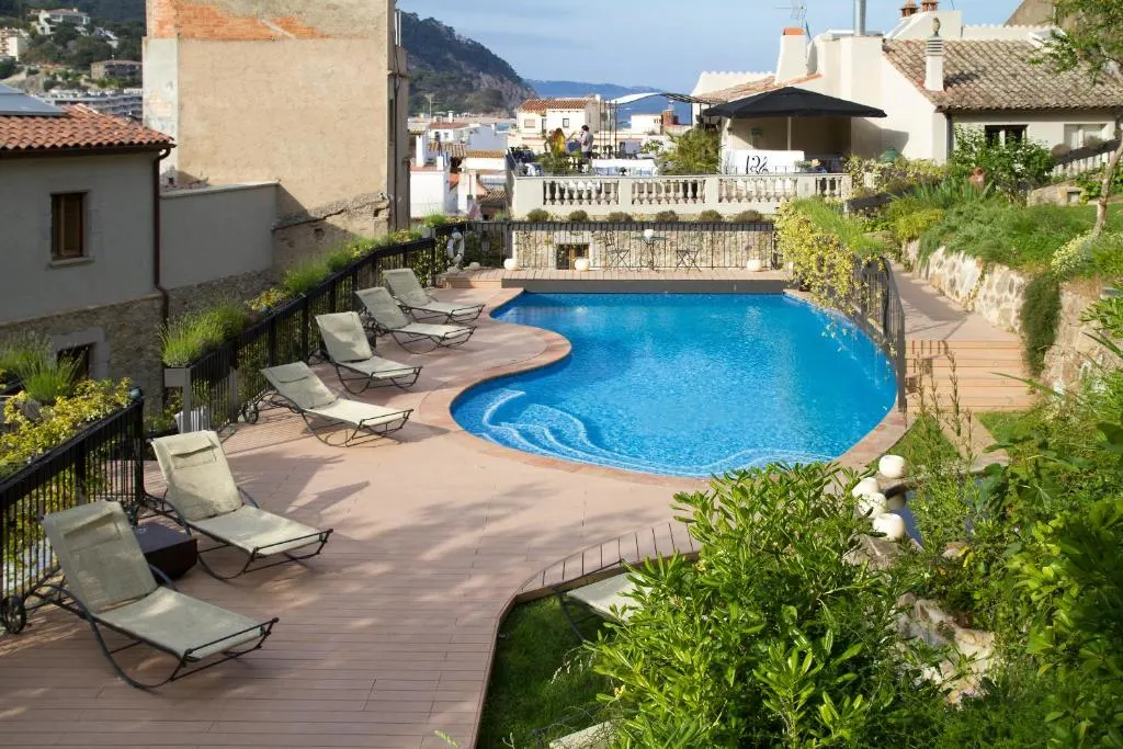 Scenic poolside area with loungers and lush greenery