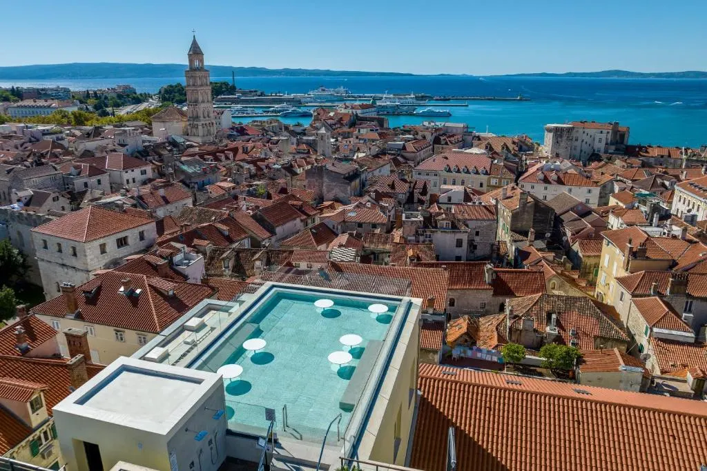 Aerial view of a historic city with a pool