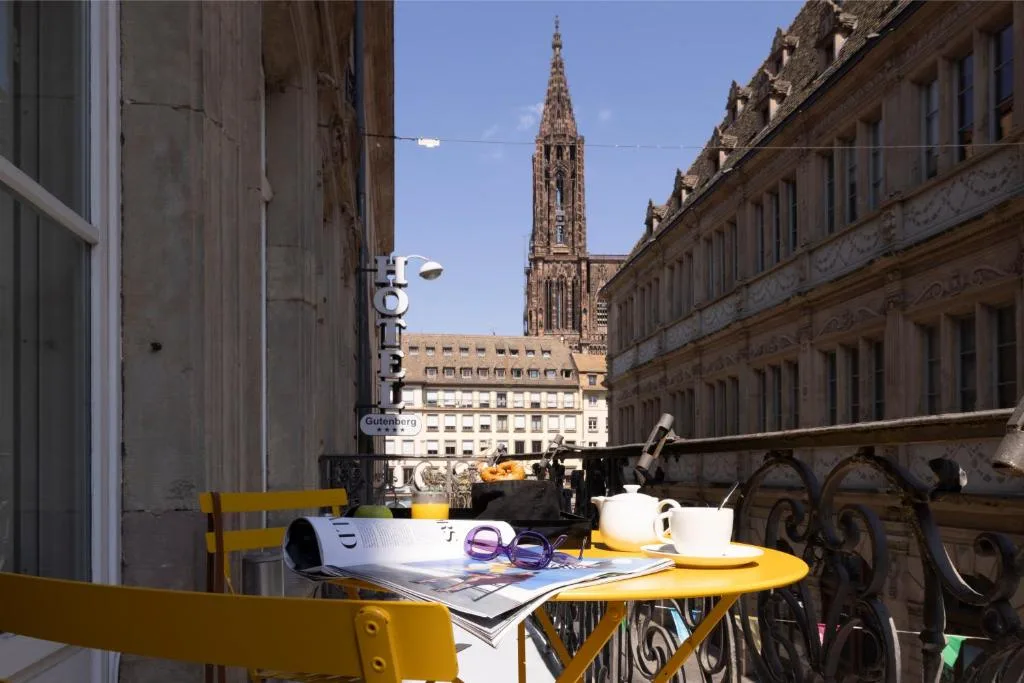 Cafe table overlooking cathedral in sunny urban setting