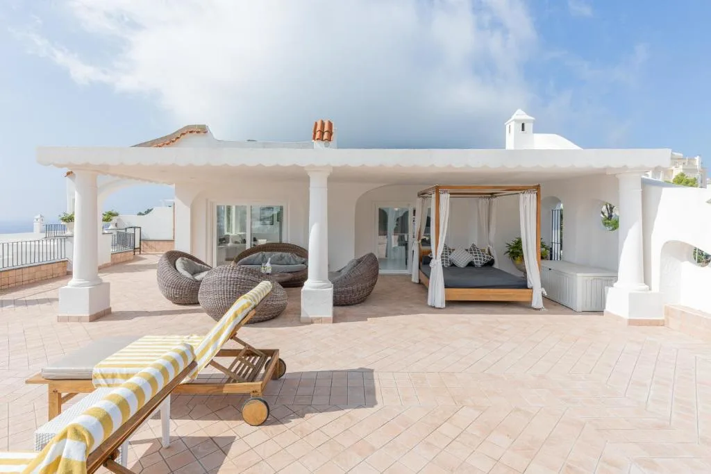 Luxurious sea-view patio with lounging furniture