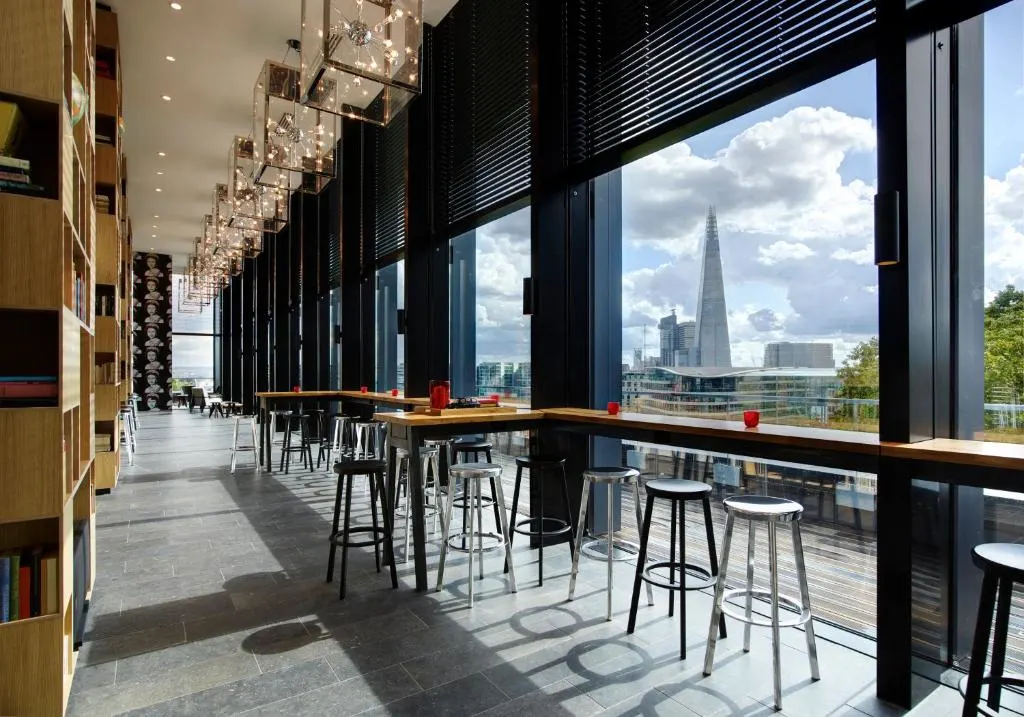 Modern bar interior with skyline view and stylish decor