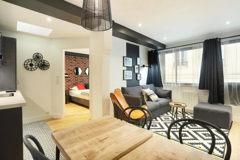 Stylish modern apartment interior with exposed brick accent