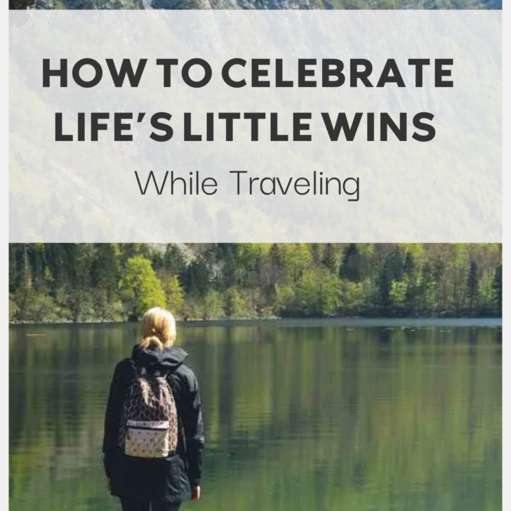 Woman celebrating quietly by a tranquil mountain lake