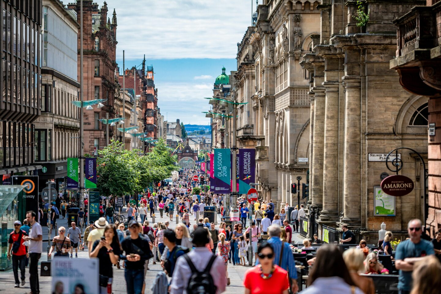 Crowded street scene in Glasgow on a sunny day