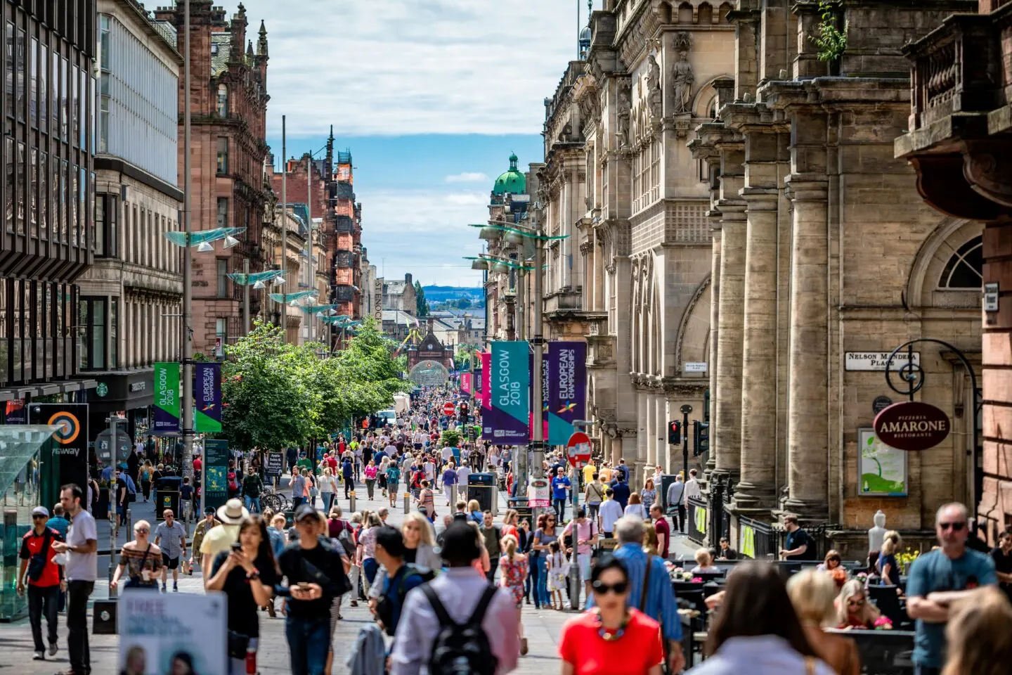 Crowded street scene in Glasgow on a sunny day