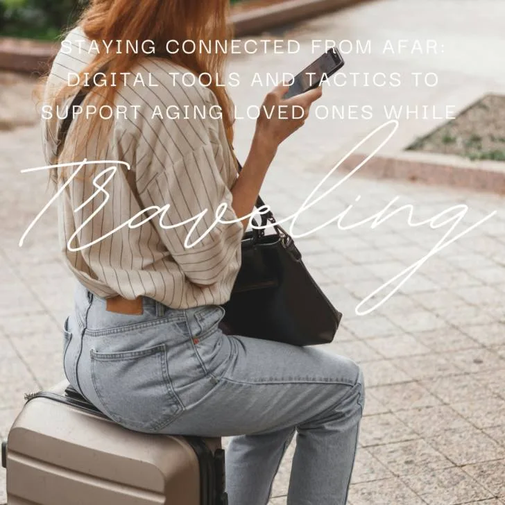 Woman using smartphone while sitting on suitcase outdoors
