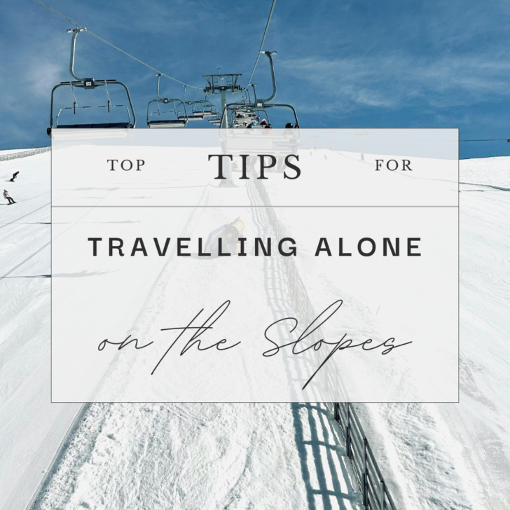 Ski lift and snowy slope with travel tips sign