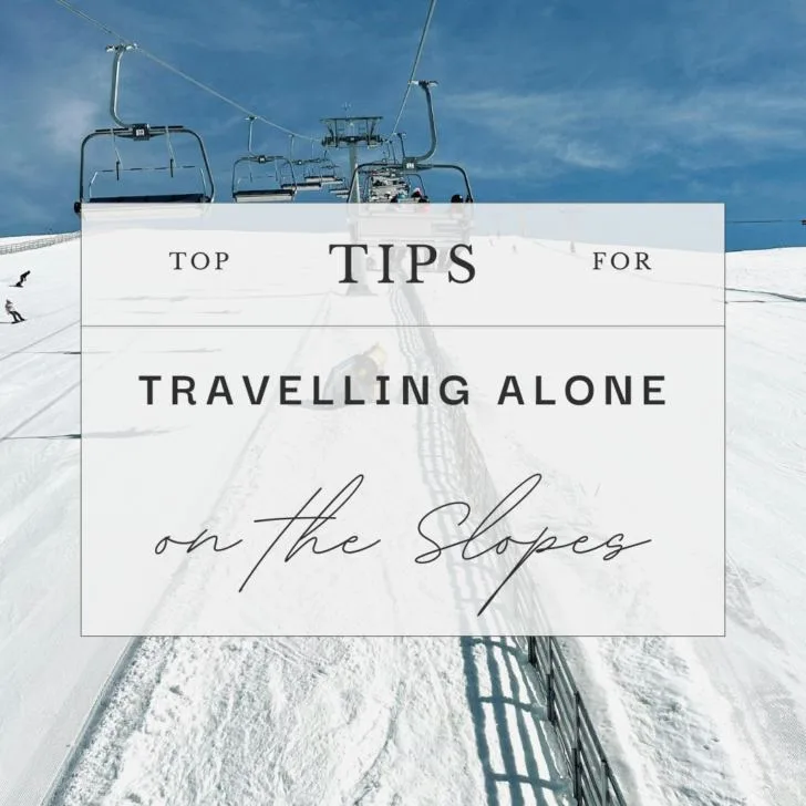 Ski lift and snowy slope with travel tips sign