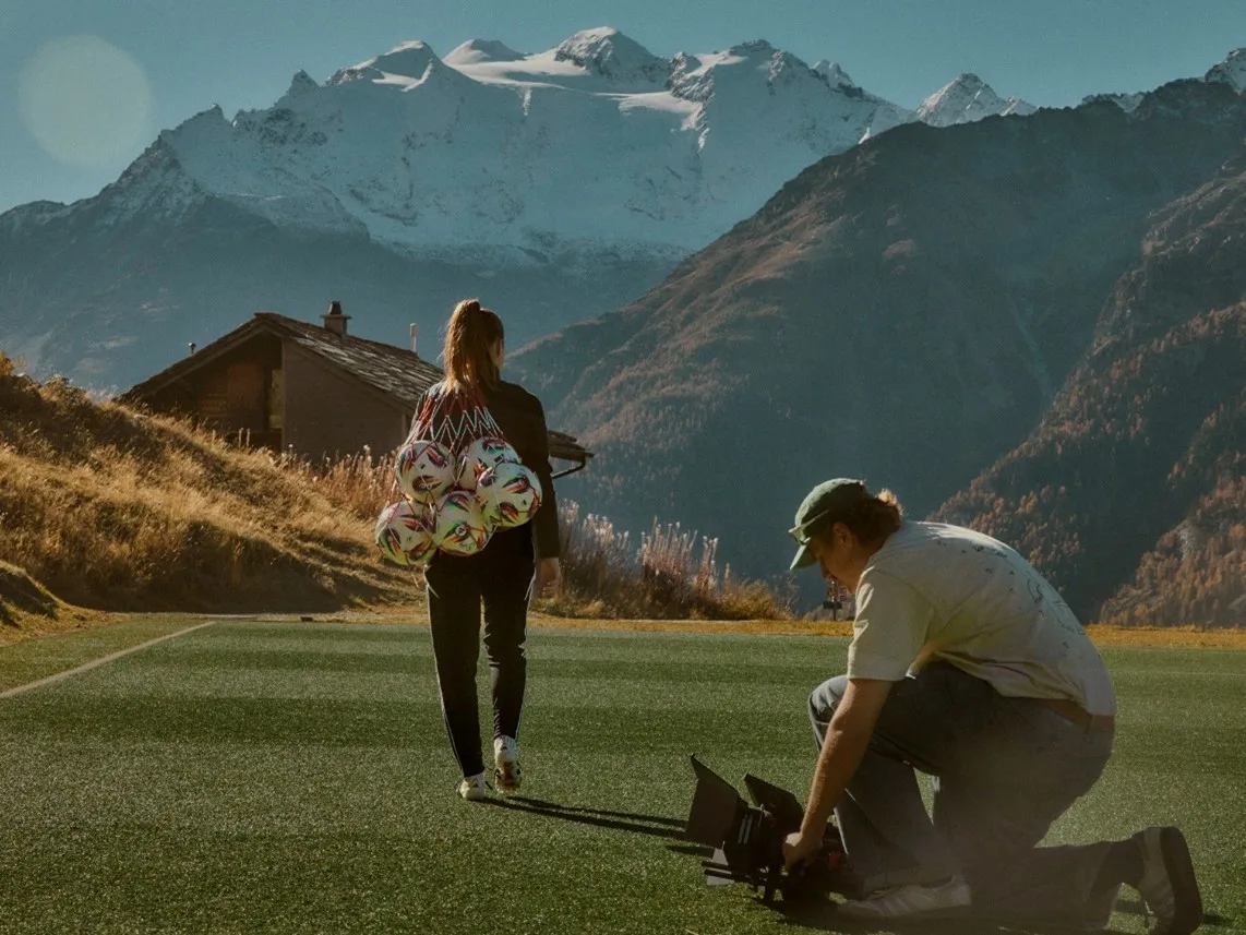 Filming a soccer-themed scene in mountainous terrain