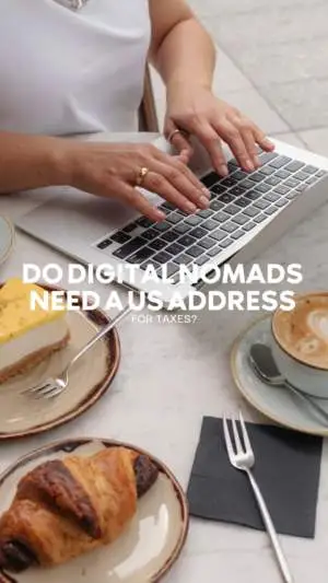 Woman typing on laptop with coffee and pastries