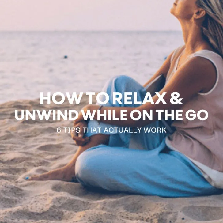 Woman meditating peacefully on beach at sunset