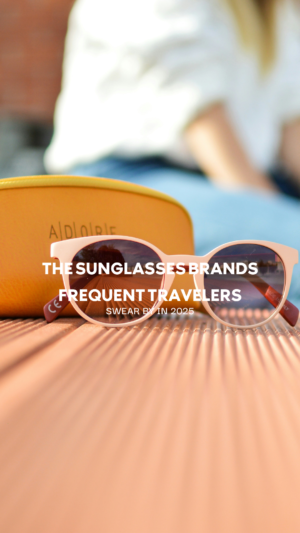 Sunglasses on suitcase promoting travel