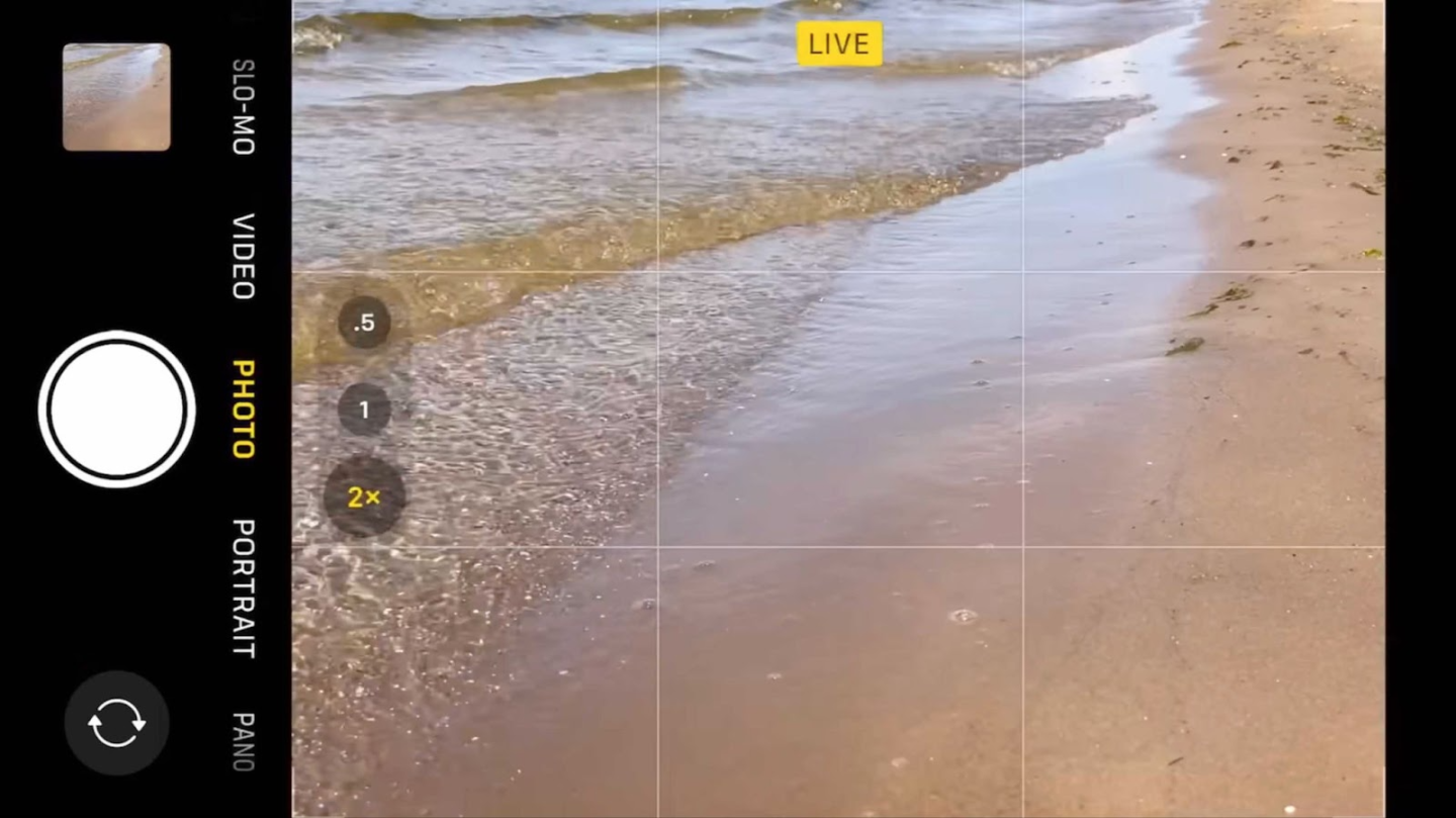 Smartphone camera interface capturing gentle beach waves