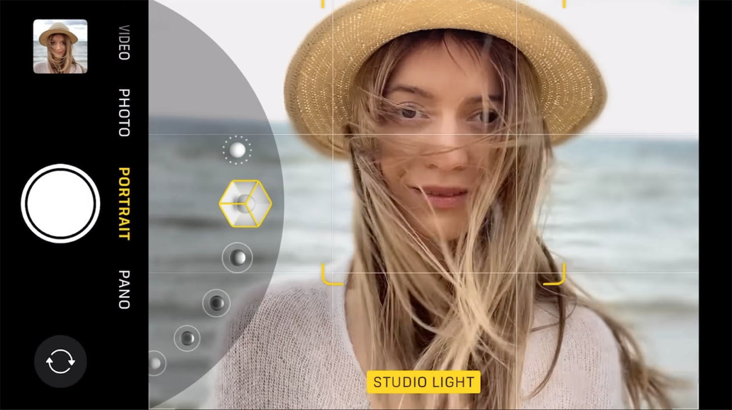 Woman in hat using portrait mode on camera interface