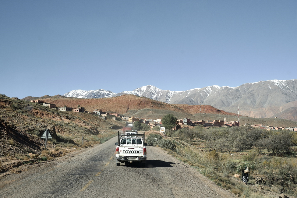 Truck driving through mountainous Moroccan landscape