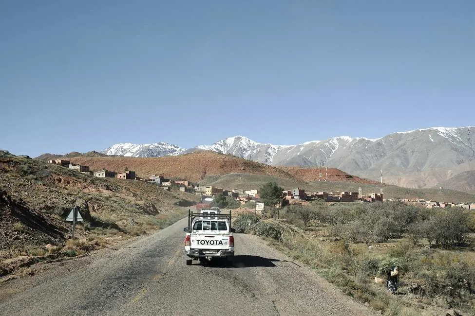 Truck driving through mountainous Moroccan landscape