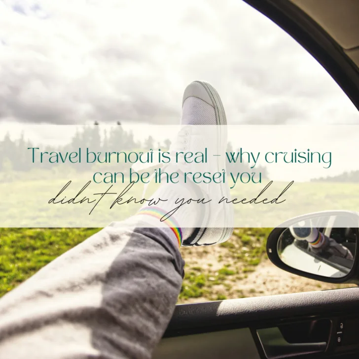 Leg out car window, shoe and countryside view.