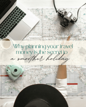 Travel planning with map, camera, and laptop on desk