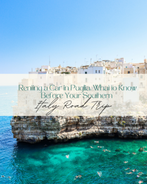 Coastline of Puglia, Italy with cliffside buildings and swimmers