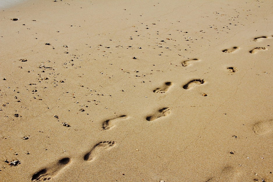 Footprints on sandy beach