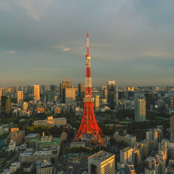 Tokyo Tower at sunset amidst cityscape